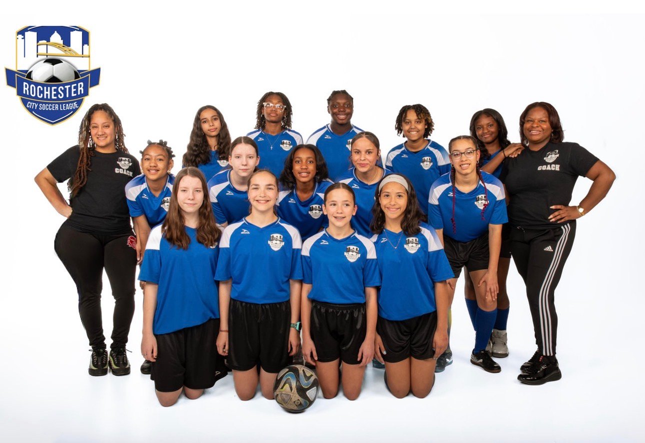 An RCSL girls team and their coaches posing together in blue jerseys